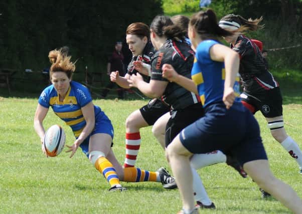 The Rugby4Heroes event took place at Old Leamingtonians Rugby club over the weekend. OL's Lois Moulding passes the ball during Old Leamingtonians Ladies against the Rugby Lionesses. MHLC-14-05-16 Rugby4Heroes 2016 NNL-160514-223334009