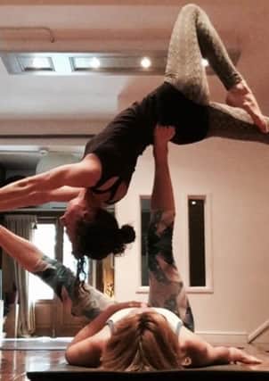Acroyoga blends acrobatics with yoga and healing arts such as Thai massage and therapeutic flying.
