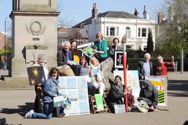 Stephanie Kerr, executive director at BID Leamington, Carole Sleight, organiser of Art in the Park, with Art in the Park committee members and exhibitors.