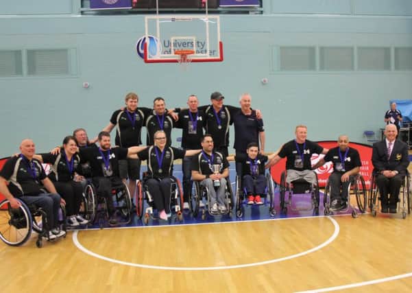 Warwickshire Bears celebrate lifting silverware at the British Wheelchair Basketball national play-offs. Picture submitted