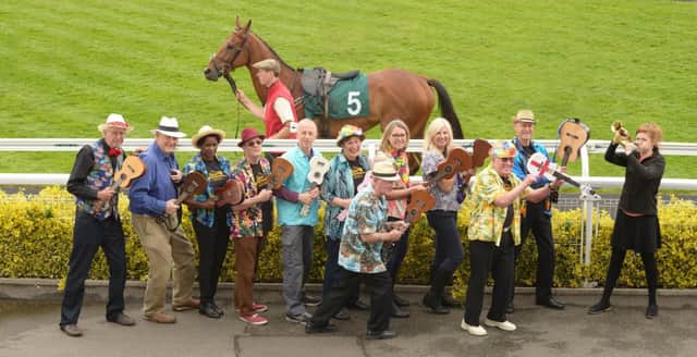 The Spa Strummers with Jess Mayers (far right) from Warwick Racecourse. Photo by Jamie Gray.