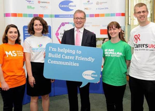 Mark Pawsey with carers from a number of charities, including the Multiple Sclerosis Society and MacMillan Cancer Support.