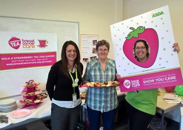 Staff at Asda in Leamington are promoting Breast Cancer Care's Strawberry Tea campaign.