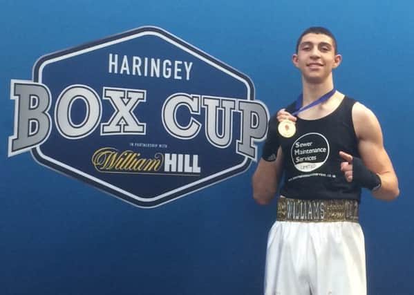 Lewis Williams shows off his gold medal after his final victory at the Haringey Box Cup. Picture submitted