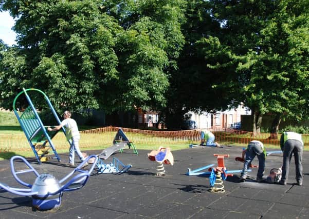 Council workers dismantle the play equipment at Oakfield rec.