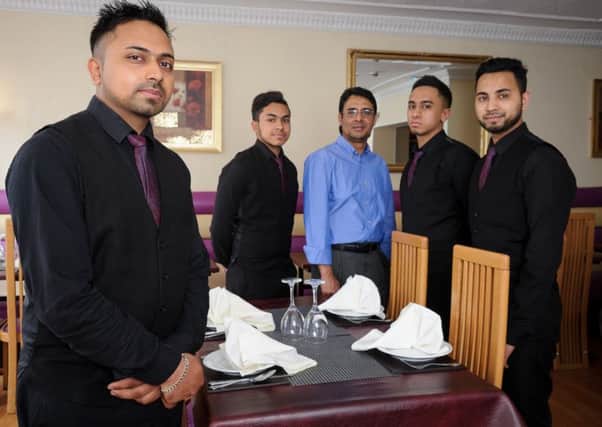 The Millenium Balti, Bath Street, Leamington Spa, has recently been awarded winner, of the Leamington Courier Curry House of the Year.  Pictured: Mohammed Ahad together with his Staff. NNL-160621-235955009