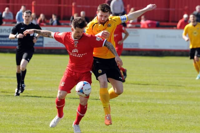 Tom James in action against Leamington for Tamworth.