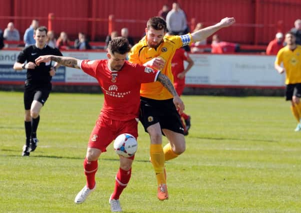 Tom James in action against Leamington for Tamworth.
