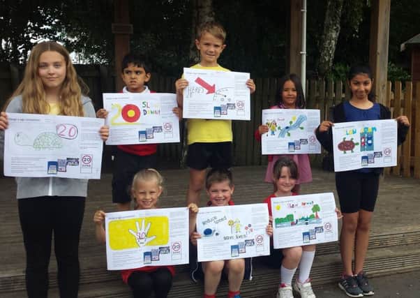 Pupils at Clifton Primary School have designed road signs for the village's new 20mph speed zone.