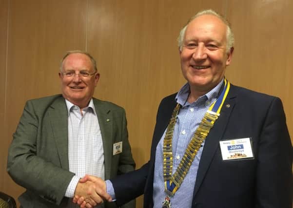 Former Kenilworth Rotary president John Kelley (left) handing over to new president John Boothroyd (right)