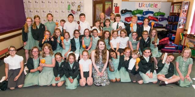Singer Beth Tysall, front centre, with pupils at Bilton Junior School