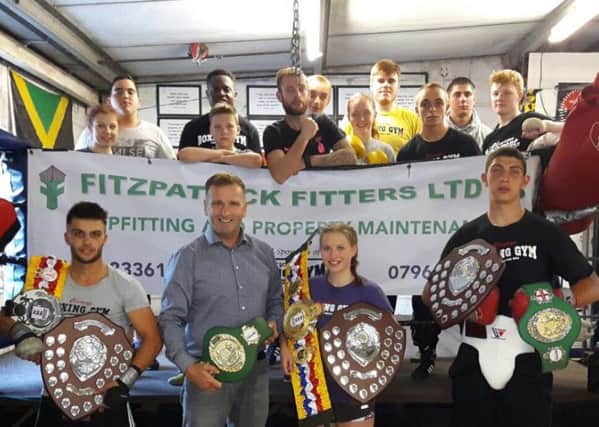 Sponsor Eddie Fitzpatrick with the award-winning boxers from Cleary's.