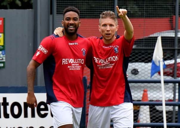 Scorer David Kolodynski acknowledges the applause for his 150th goal for the club and celebrates with Daryll Thomas    PICTURES BY MARTIN PULLEY