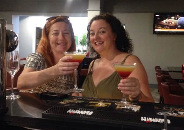 Gayle Selby (right), and her friend Laura with glasses of Gayle's creation, 'Kenilworth Sunset Kiss'