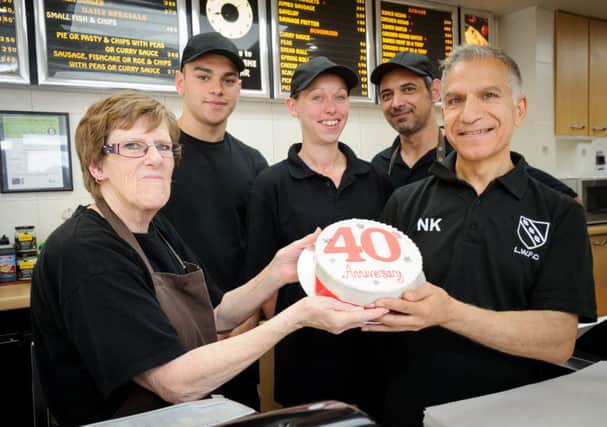 Luke Kyriacou (right) and his staff are celebrating the School Lane FIsh Bar's 40th anniversary. Luke, together with his wife Helen, started the business in 1976. NNL-160823-225544009