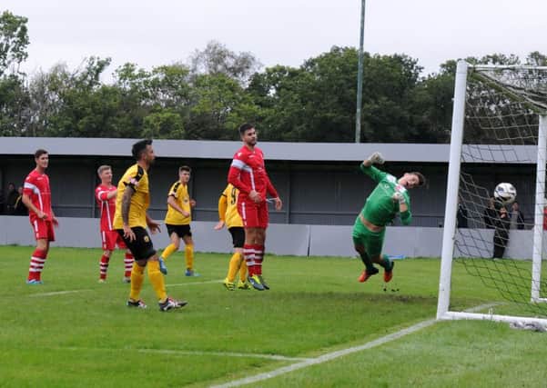 Jack Edwards loops a header past Brendan Bunn to bring it back to 3-1. Pictures: Morris Troughton