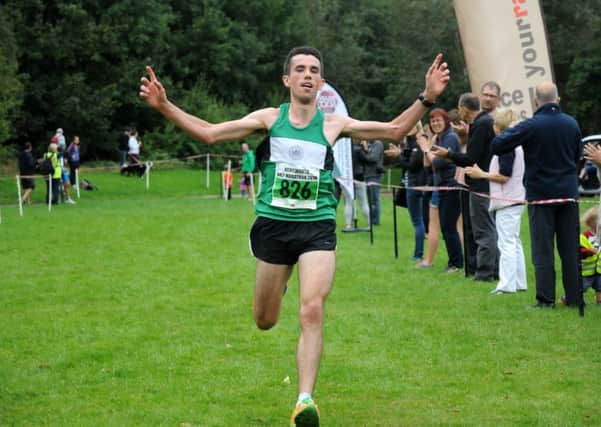 Kenilworth Runners' Paddy Roddy celebrates his victory. Pictures: Morris Troughton