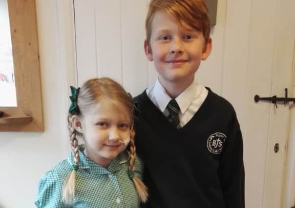 Eleanor with her brother Thomas on her first day of Junior School.
