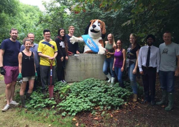 Age Concern mascot Harvey Hound with volunteers from the charity and Fuel Recruitment at the Woodland Reserve
