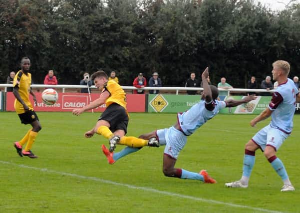 Jack Edwards puts his body on the line to get in a second-half header for Leamington. Picture: Morris Troughton