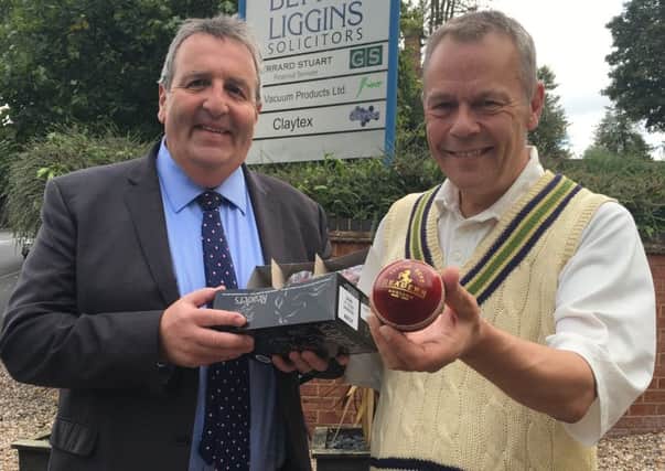 Richard Thornton, joint senior partner at Blythe Liggins Solicitors, presents Kenilworth CC secretary Andy Smith with Edmunds' Player of the Month prize.