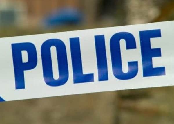 A woman in her seventies was assaulted during the break-in.