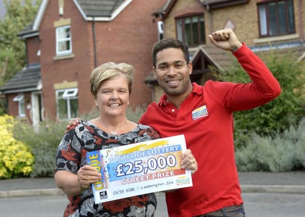 Postcode Lottery Streetprize winner Christine Guice from Leamington Spa with presenter Danyl Johnston Pictures by Paul Thomas Photographic Ltd 0121 353 7299 Mobile 07773340163 email info@ptpimages.co.uk web: www.ptpimages.co.uk