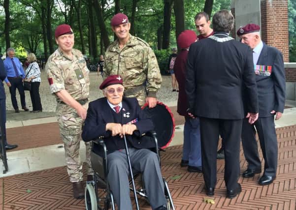 Luis DiMarco (seated), was able to visit the commemoration of Operation Market Garden in Arnhem, the Netherlands, thanks to a donated wheelchair from British Red Cross