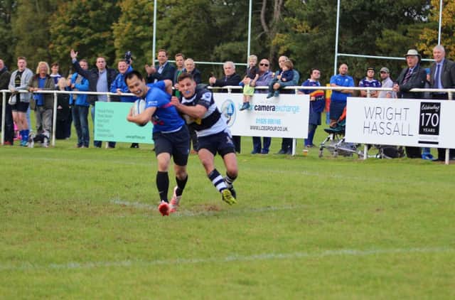 Leamington debutant Kenny Kwok is held up with the try line beckoning.