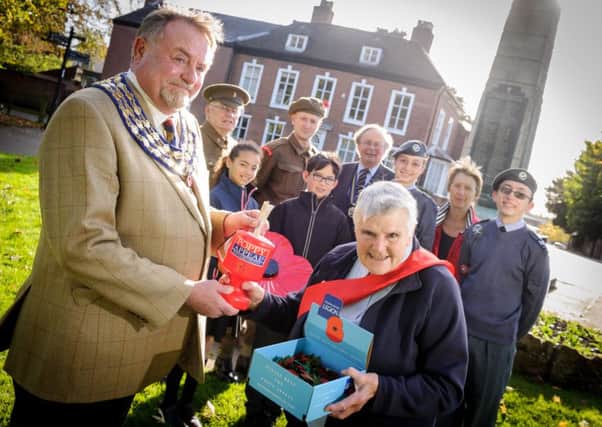 Kenilworth launched this year's Poppy Appeal recently, at the War Memorial at the top of Abbey Fields, Kenilworth.  Pictured: Mayor of Kenilworth Richard Davies, Anne Chrimes (Poppy Appeal Organiser), John Haycock, Will Thatcher, representatives from St. Nicholas C of E School, George Illingworth (Chairman of the Royal British Legion - Kenilworth), Debora La Porta (C.W.O.), James Fitzpatrick (Sgt.) & Margaret Kite. NNL-161018-230328009