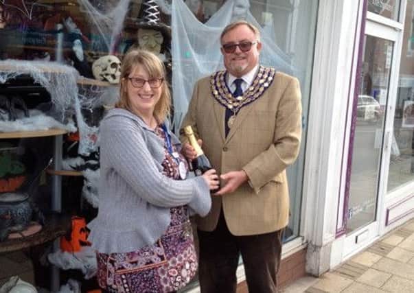 Ros Bannister of Headway being presented with her prize by town mayor Cllr Richard Davies