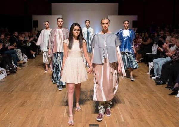 Sophie Gordon, front left, shows off her her winning designs on the cat walk at the Midlands Fashion Awards. ClaH3S2ubQUCZCPrhO8l