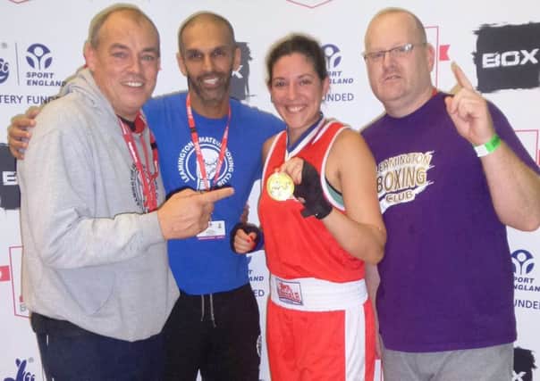 Jade Yeomans celebrates with her coaches after her Senior Development Championship success. Picture submitted