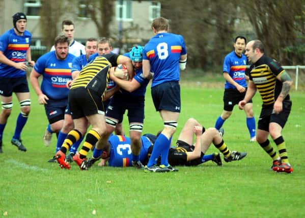 Leamington's Ed Thompson relieves Dunlop of possession to get his side on the move. Picture: Gina Ruyssevelt