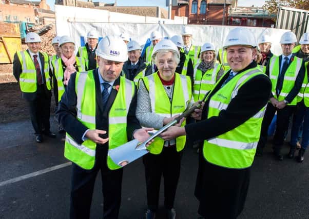 The ground breaking ceremony for the new Bath Place supported accomodation project took place on Friday. Cllr Jose Compton (centre)  officially opened the building site.