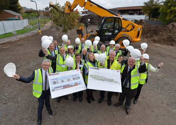 (front left) Anthony Riley, Group Director of Development and Operations at Waterloo Housing Group, with representatives from the Homes and Communities Agency, Warwick District Council, AC Lloyd and Stagecoach.