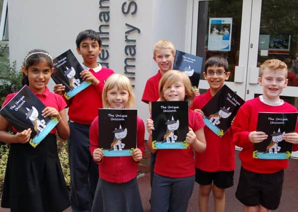 Sydenham Primary School pupils with copies of The Unique Unicorn. NNL-161114-142433001