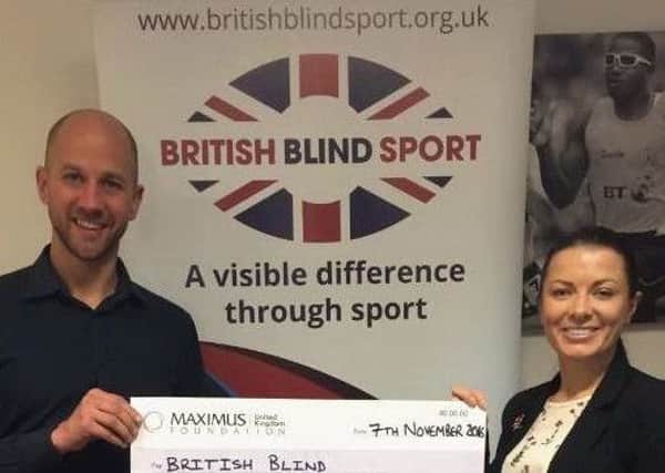 British Blind Sport fundraising manager Ian Carr and chief executive Alaina Macgregor with the grant cheque. NNL-161115-110531001