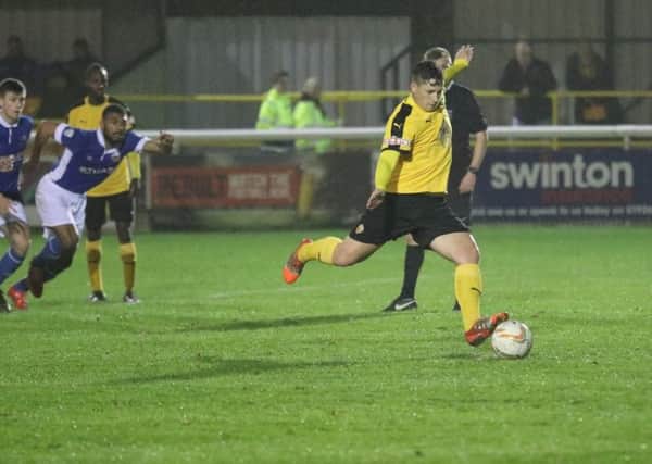 Ryan Rowe confidently slots home Leamington's second from the penalty spot.