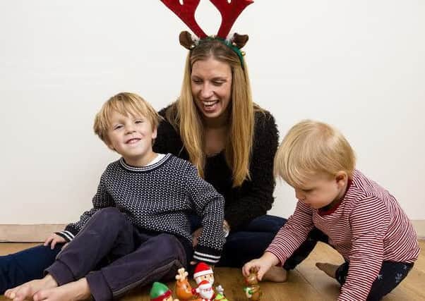 Jenna Blemmings with her sons, preparing for their Christmas Art Splats session. NNL-161116-143405001