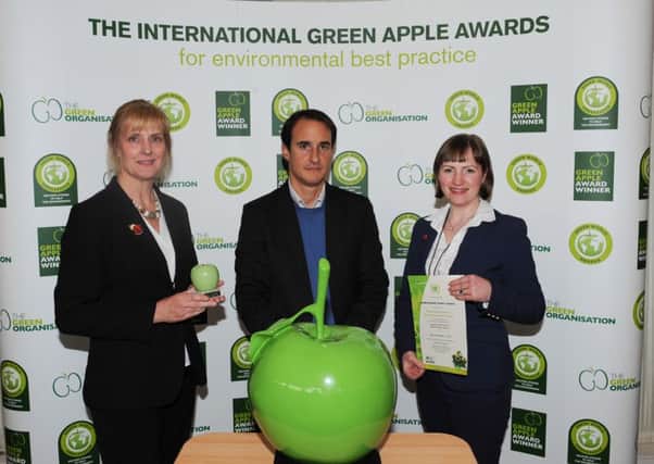 Yep, food recycling's a winner. Warwickshire County Council Waste Management representatives Caroline Faulkner (left) and Ruth Payne being presented with WCCs Gold Green Apple Award by Francois Sonnet  founder of the Solar Coin  at the Houses of Parliament. NNL-161121-145715001