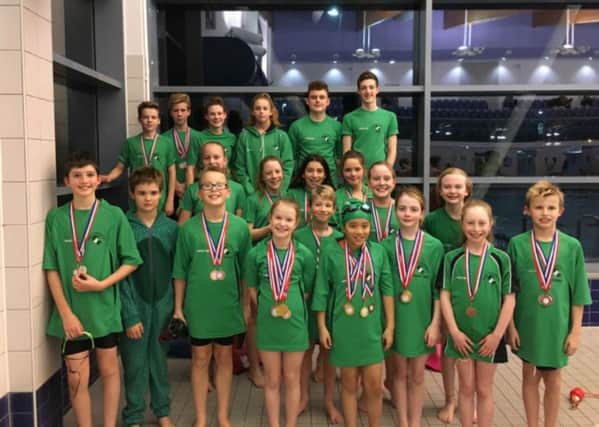 Rugby's swimmers with their medals from the Coventry November Open