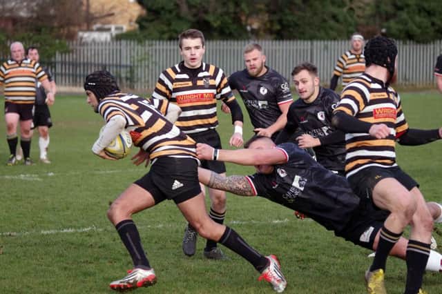 Ash Williams tackling, with Andy Bowyer and Sam James in the background   PICTURES BY RAY ANDREWS