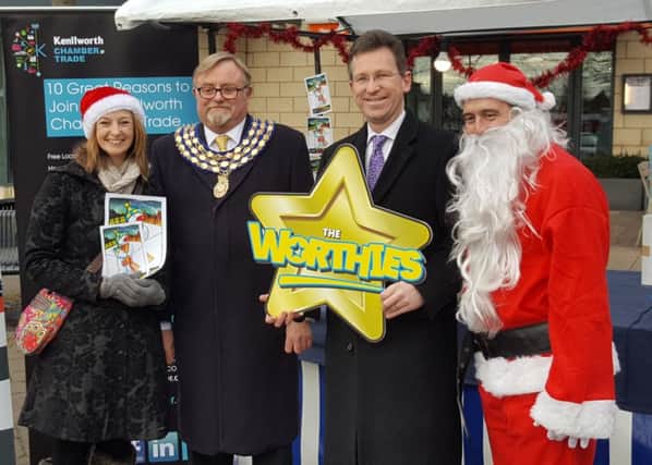 The launch of the 'Buy one Present in Kenilworth' campaign at the Chritsmas market in Abbey End on Saturday December 3. From left: SeÃ¡nna Holland, Kenilworth mayor Cllr Richard Davies, Jeremy Wright MP and Cllr Richard Hales.