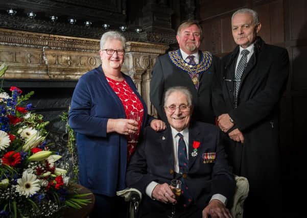 Kenilworth Veteran Bernard Stone, was presented with a medal this week, at a gathering hosted at the Gatehouse, Kenilworth Castle, to recognise his appointment to the rank of Chevalier in the Ordre national de la Legion d'honneur. From left: Barbara Stone, Bernard Stone, Kenilworth mayor Cllr Richard Davies, and French consul Robert Mille. NNL-160612-194819009