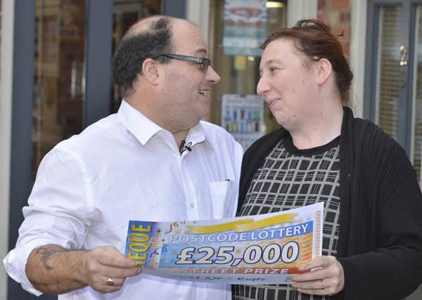 David Tanser with his partner after winning on the postcode lottery.