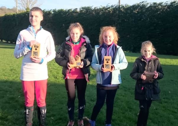 Winners of West Midlands Orienteering Championships: (l to r) Peter Markham, Pippa Smart, Florence Lunn and Tilly Flippance with their trophies.