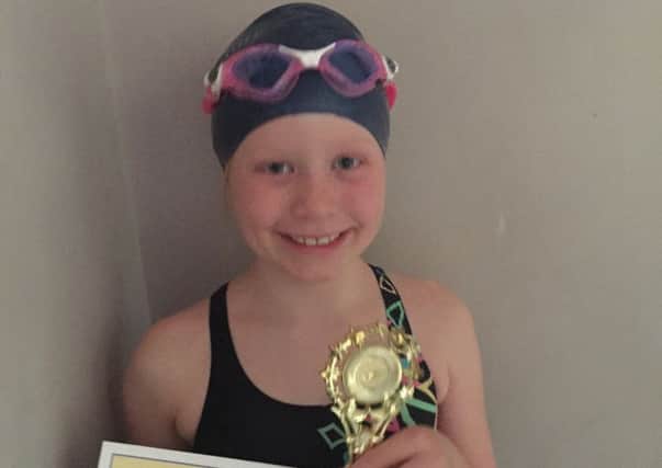 Lola Knightley, eight, who swam 4,000m without stopping for charity