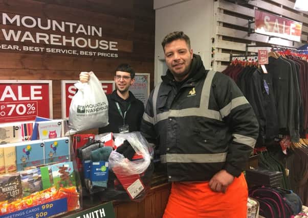 James Hilling buying gloves, hats and scarves for the homeless.