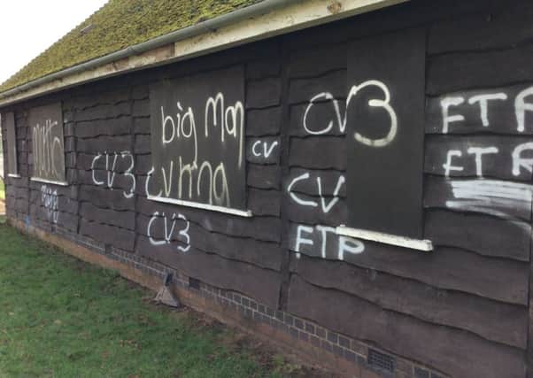 Graffiti sprayed on one side of the pavilion in Abbey Fields